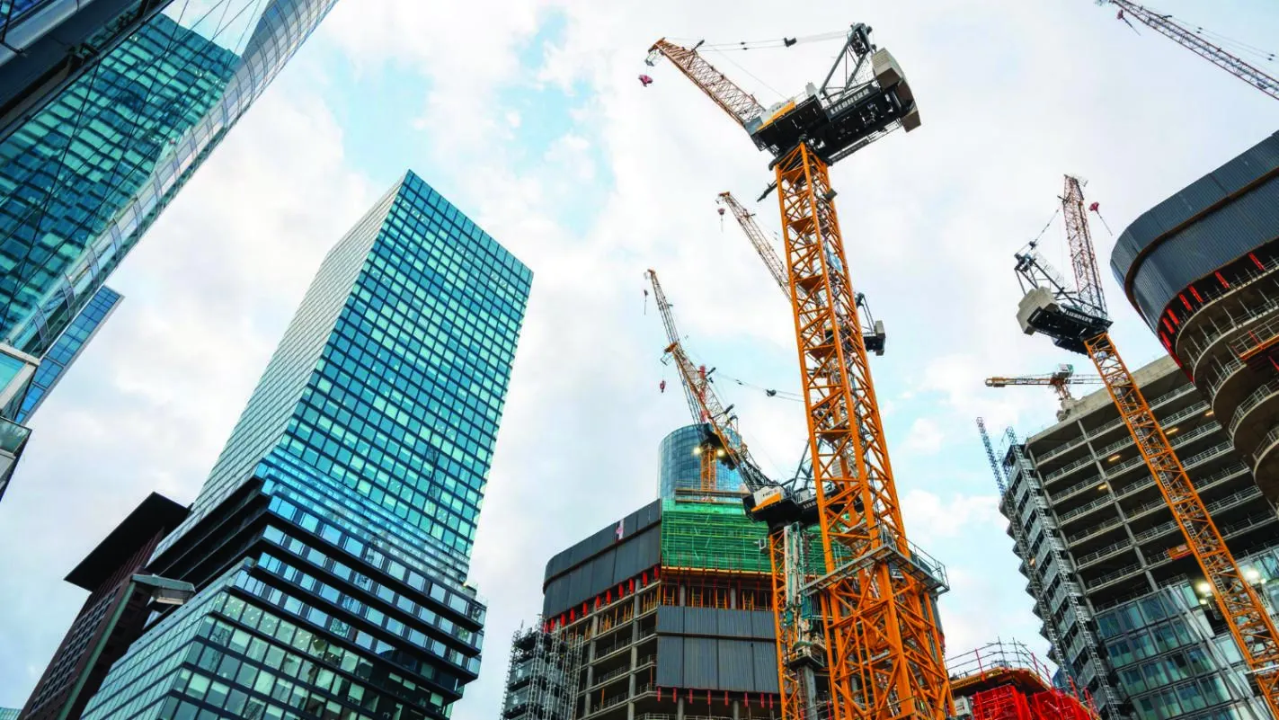 Construction cranes between rising buildings, from the KEP company profile
